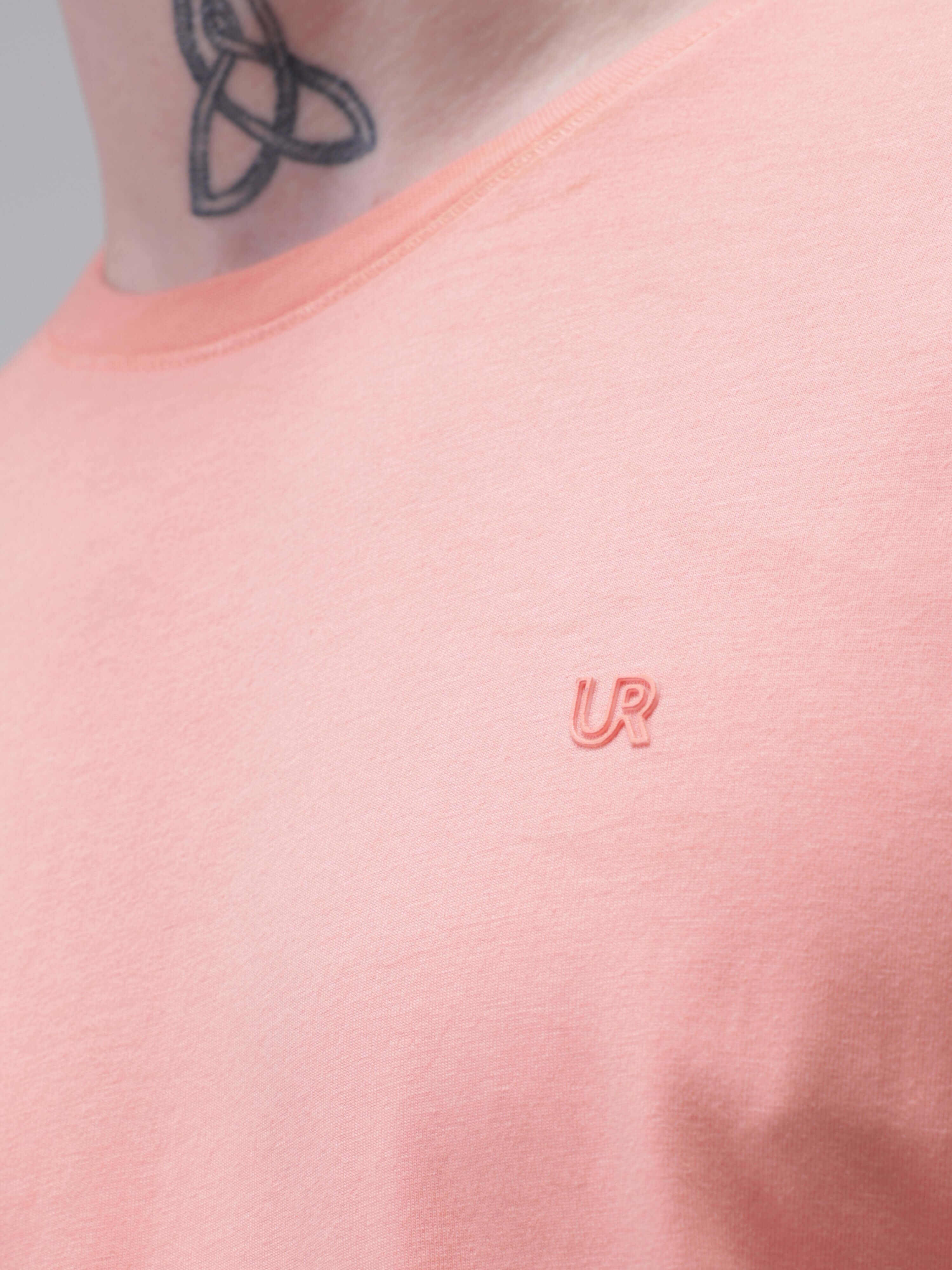 Close-up of Sunset Spice Turms T-shirt with stain-proof, odor-resistant, and stretchable fabric in tailored fit and crew neckline.