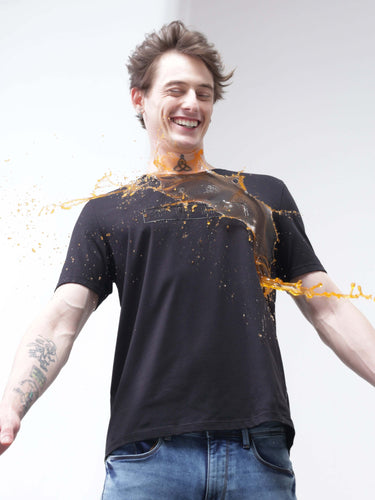 Man wearing Midnight Elegance anti-stain, anti-odor, stretchable Turms T-shirt with spill repelling off, showcasing intelligent apparel.