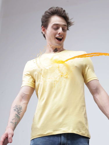 "Model wearing Amber stain-proof and odor-resistant Turms T-shirt with COOLTECH, new Honey Comb fabric, and anti-odour technology, repelling spill"