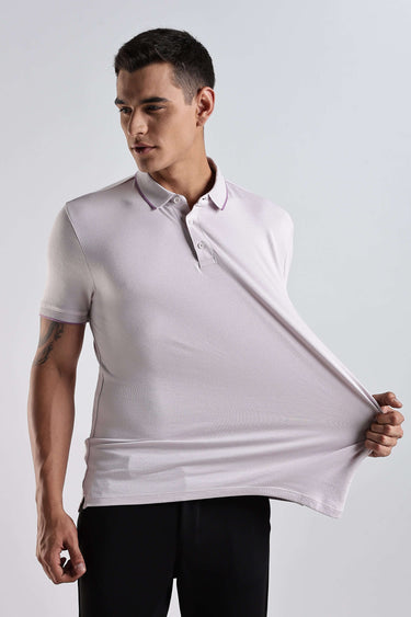 Man showcasing the Lavender Fires cotton polo t-shirt, highlighting its premium comfort and stylish design.