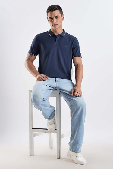 Model wearing Orion Blue cotton polo tshirt, showcasing premium style and comfort.