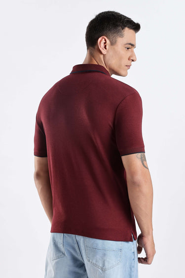 Back view of a man wearing a Country Wine premium cotton polo t-shirt, showcasing style and durability.