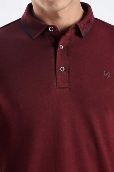 Close-up of a man wearing a Country Wine cotton polo tshirt, showcasing premium style and comfort.