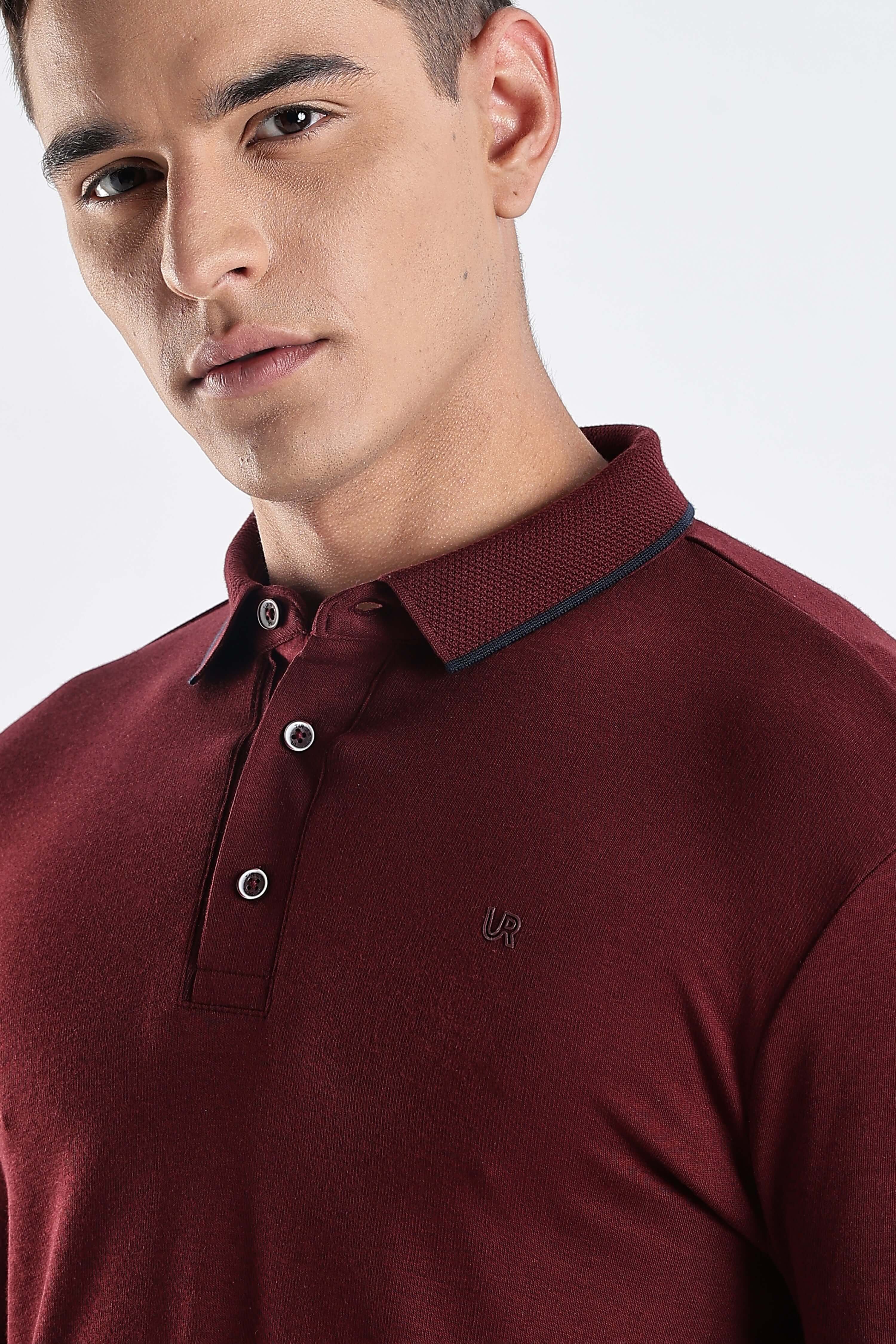 Close-up of a man wearing a Country Wine polo tshirt, showcasing its premium cotton and stylish design.