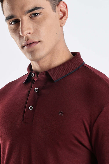 Close-up of a man wearing a Country Wine polo tshirt, showcasing its premium cotton and stylish design.