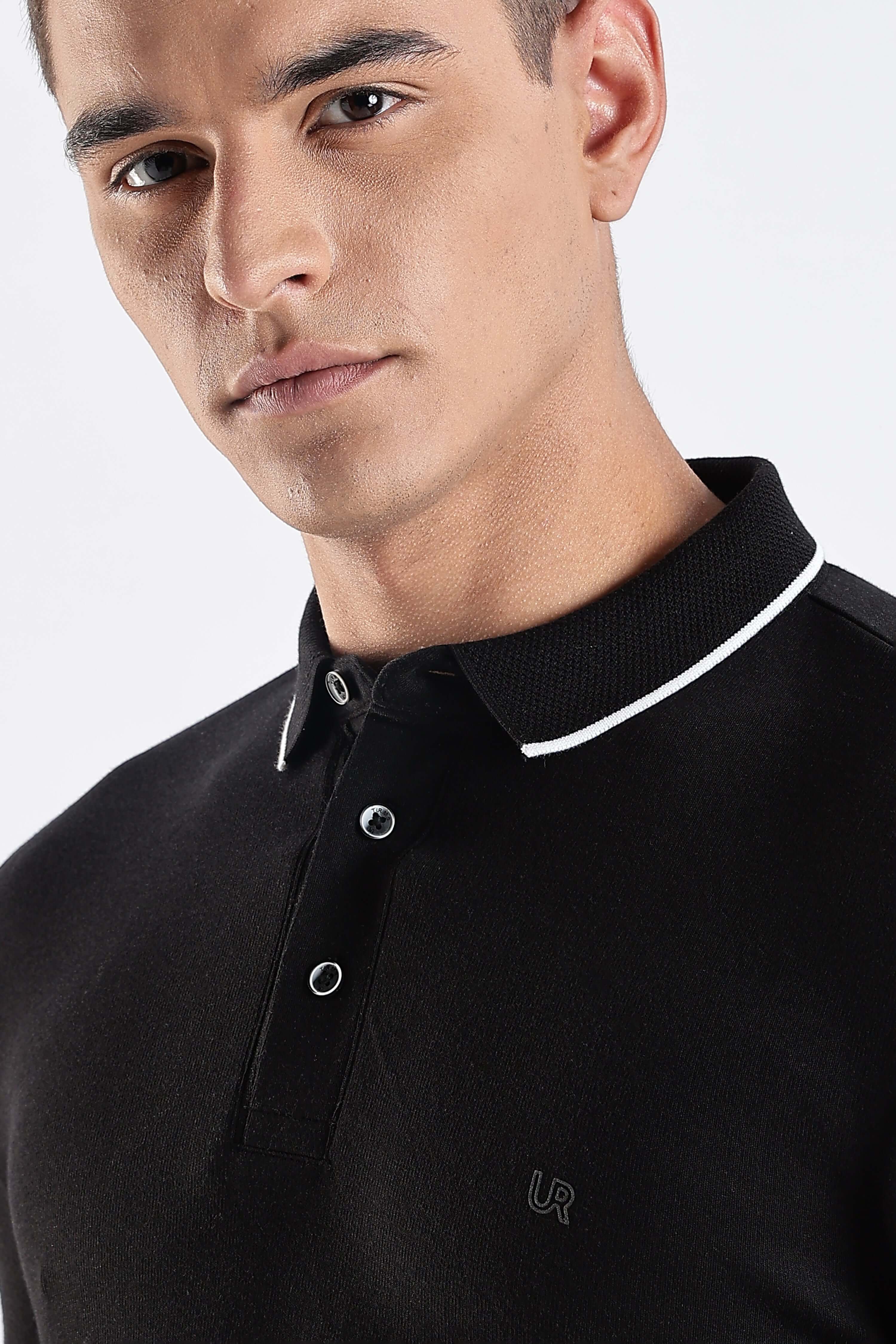 A close-up of a man wearing a Black Primal cotton polo t-shirt with a stylish collar and buttons, highlighting its premium quality.