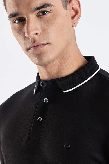 A close-up of a man wearing a Black Primal cotton polo t-shirt with a stylish collar and buttons, highlighting its premium quality.