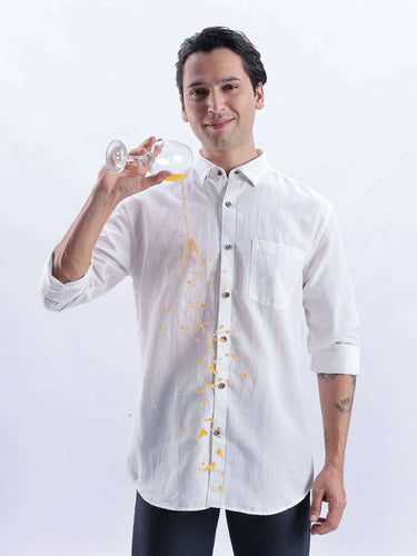 White Elephant wearing a premium linen shirt from Turms Intelligent Apparel showing water repellent feature.