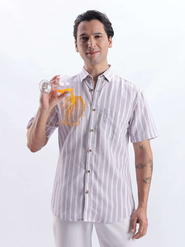 Model wearing a Lilac Haze linen shirt from Turms Intelligent Apparel, showcasing its stylish and breathable design.