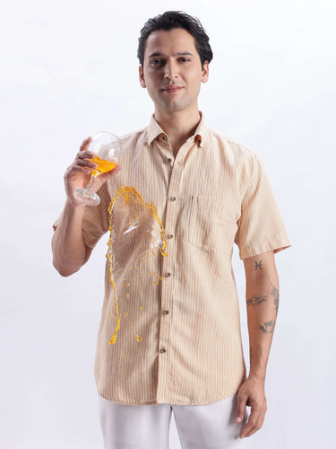 Cinnamon Dream linen shirt showcasing premium water-proof, anti-odour, and anti-stain features in action.