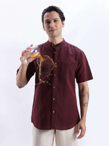 Castlevania, model in maroon Turms Intelligent Linen shirt showcasing anti-stain features with beverage spill.