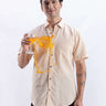 Man wearing Opalescent Sand linen shirt from Turms Intelligent Apparel showcasing anti-stain feature.