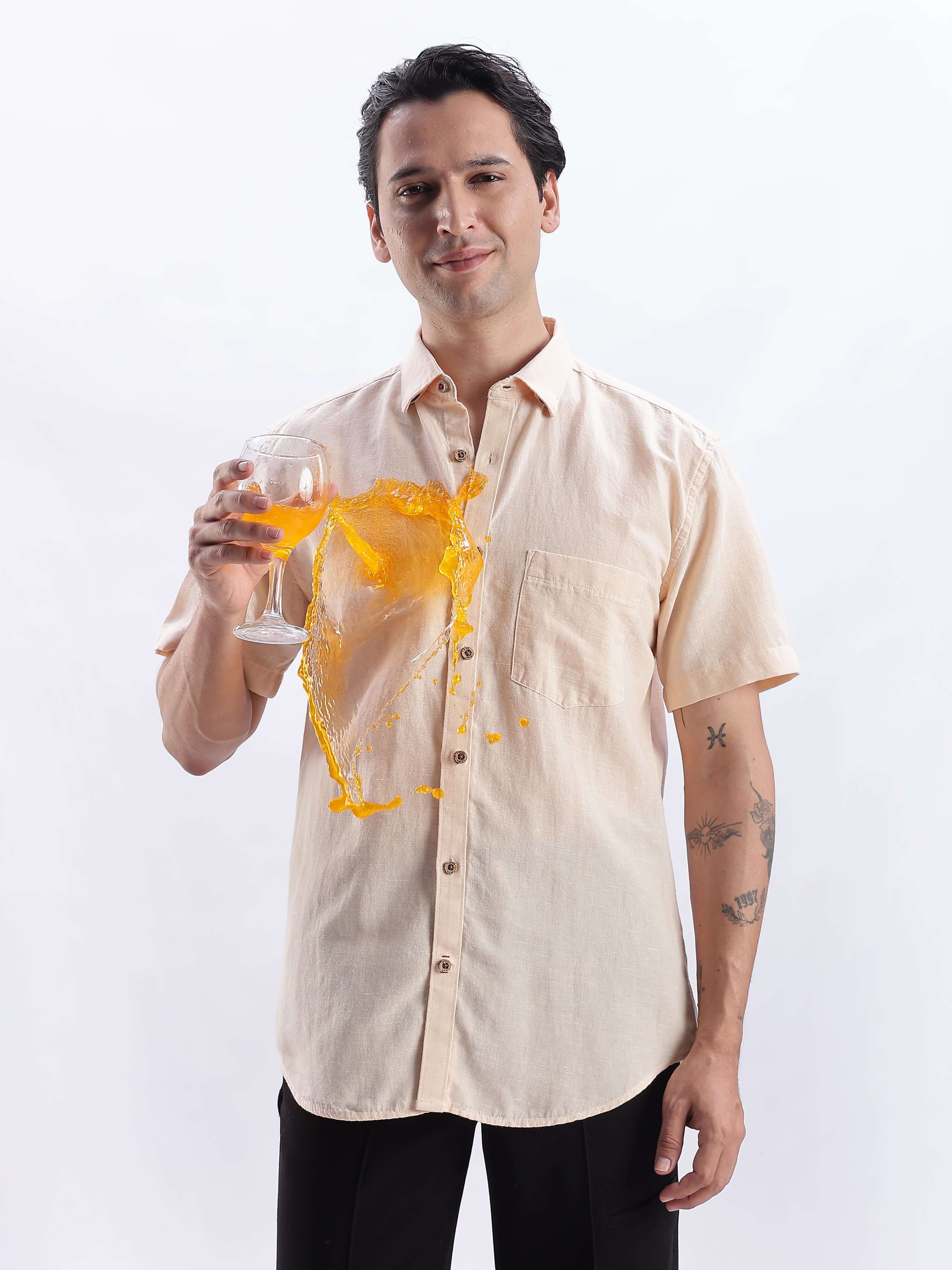 Man wearing Opalescent Sand linen shirt from Turms Intelligent Apparel showcasing anti-stain feature.