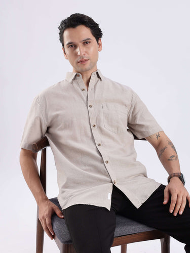 Desert Rider, a premium linen shirt from Turms Intelligent Apparel, stylish and breathable, model wearing on a chair.