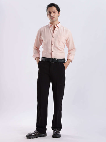 Peach Fuzz premium linen shirt from turms intelligent apparel worn with black pants.