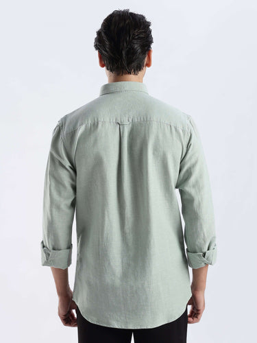 Back view of a man wearing a Canary Green premium linen shirt from turms intelligent apparel.