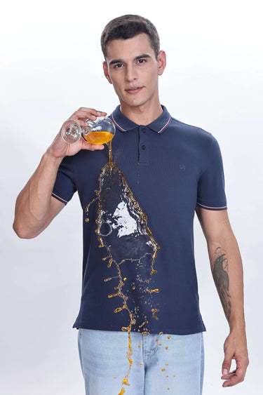 Orion Blue cotton polo tshirt, premium quality, showing waterproof and antistain features with spilled drink.