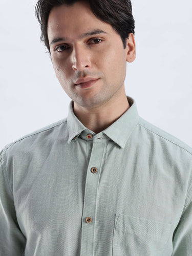 Fern Green linen shirt from Turms Intelligent Apparel, showcasing breathable, anti-odour, and waterproof features.