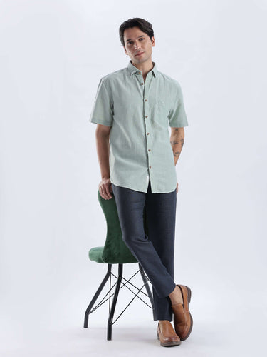 Fern Green linen shirt from Turms Intelligent Apparel, featuring anti-stain, waterproof, and breathable qualities.