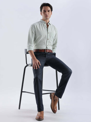 Model wearing Pistachio Green premium linen shirt by Turms Intelligent Apparel, paired with dark trousers.