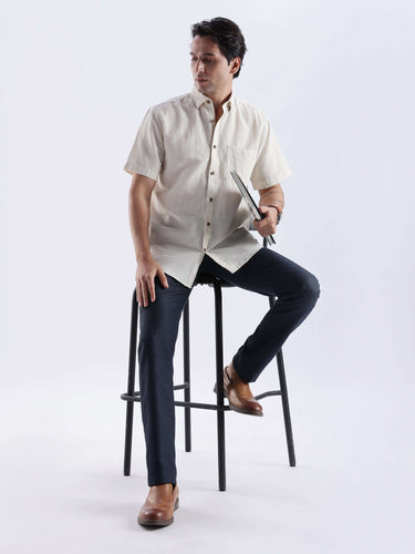 Man wearing a Sandy Glow linen shirt, showcasing premium Turms Intelligent Apparel, with waterproof and anti-odour features.