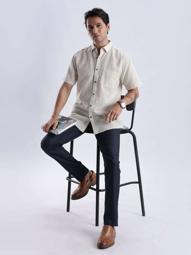 Model wearing Sandy Glow linen shirt, showcasing premium Turms Intelligent apparel with waterproof, anti-odour, and anti-stain features.