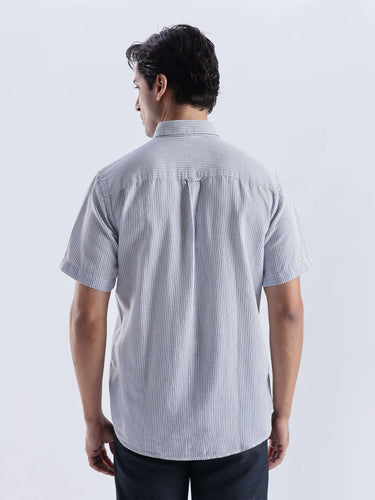 Jordy Blue, a stylish linen shirt from Turms Intelligent Apparel, featuring a durable anti-stain and waterproof design.