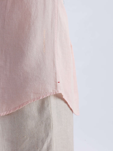 Blushy peach linen shirt from Turms Intelligent Apparel, featuring anti stain, waterproof, anti odour, and breathable qualities.