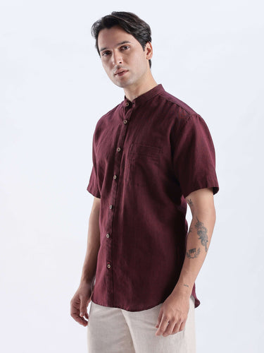Castlevania: Model wearing a burgundy linen shirt from Turms Intelligent Apparel, showcasing style and luxury.