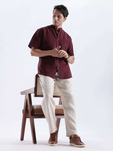 Castlevania: Model wearing a stylish burgundy linen shirt from Turms Intelligent Apparel, showcasing elegance and comfort.