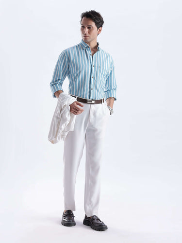 Cerulean Monk premium linen shirt from turms intelligent apparel styled with white trousers for a chic look.