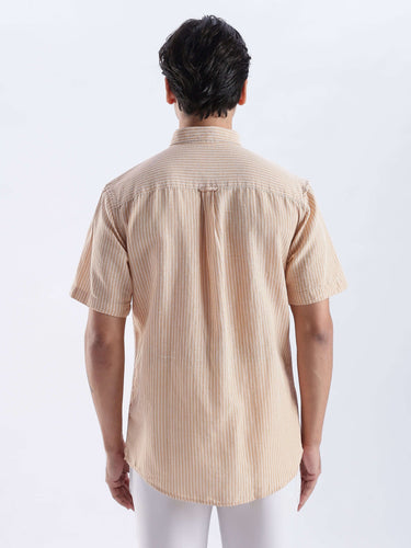 Back view of a man wearing the Cinnamon Dream premium linen shirt, showcasing its stylish design and quality craftsmanship.