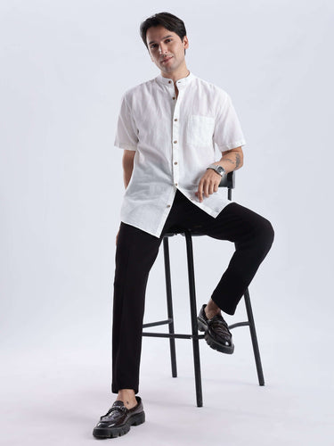 Model wearing Frosty Lion linen shirt from Turms Intelligent Apparel, showcasing style and functionality in everyday luxury.