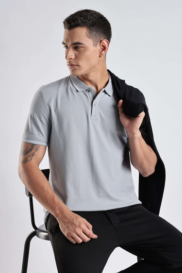 Model wearing Magma Grey cotton polo tshirt, showcasing premium style and comfort for men.