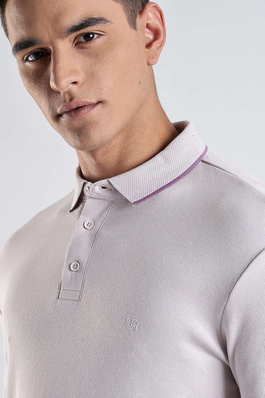 Close-up of a man wearing a Lavender Fires premium cotton polo tshirt with stylish collar.