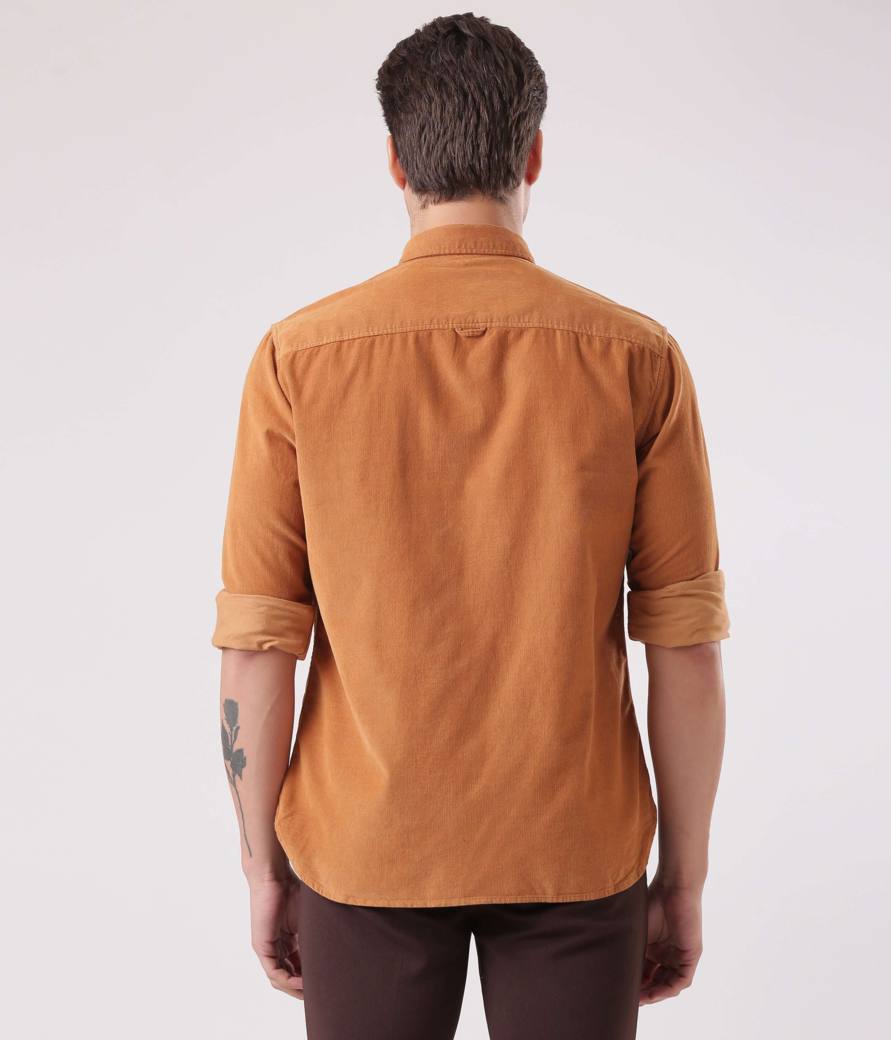 Back view of a man wearing the Brown Toffee corduroy shirt, showcasing its stylish design and quality craftsmanship.