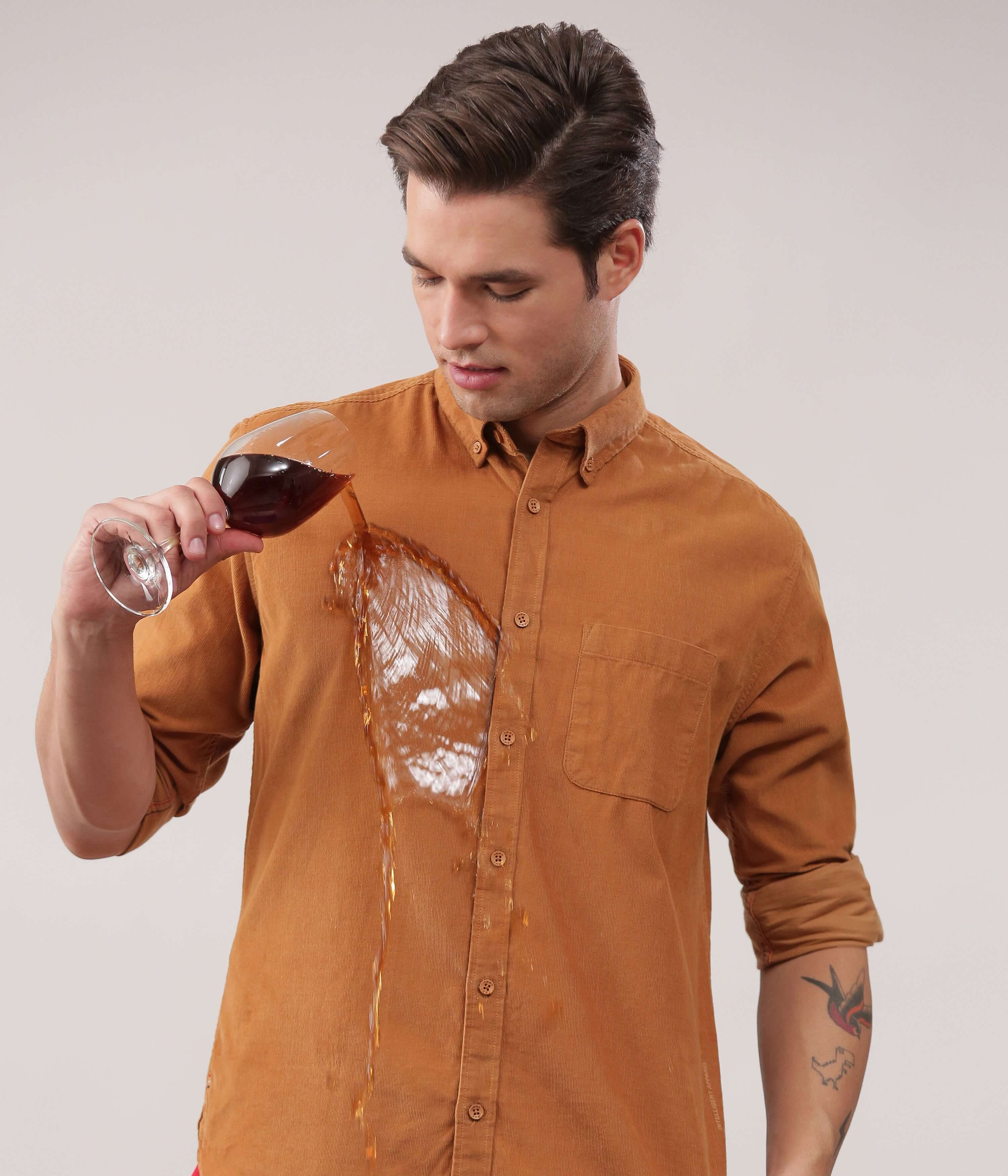 Brown Toffee corduroy shirt demonstrating water resistance with spilled drink, showcasing Turms Intelligent Apparel.