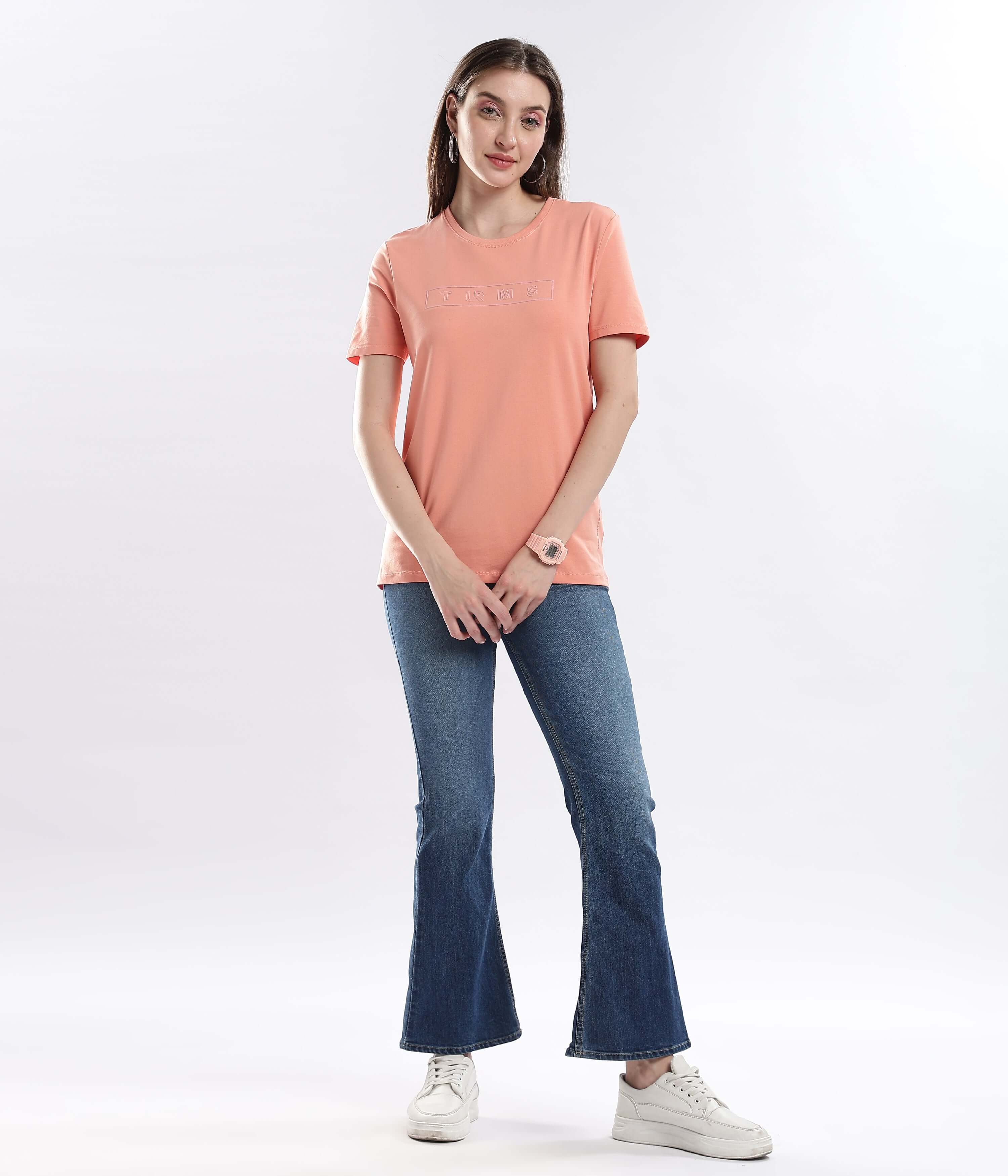 Model wearing Womens casual t-shirt Ember Orange cotton tshirt with stretchable, waterproof, and anti-odour features.