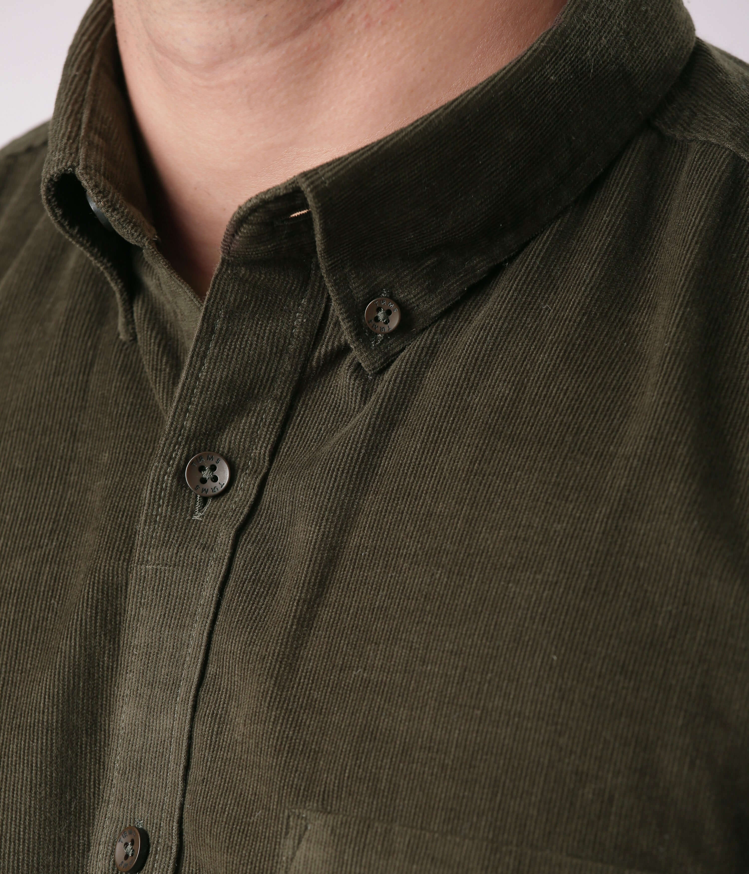 Emerald Star corduroy shirt featuring stylish collar and durable button details from Turms Intelligent Apparel.