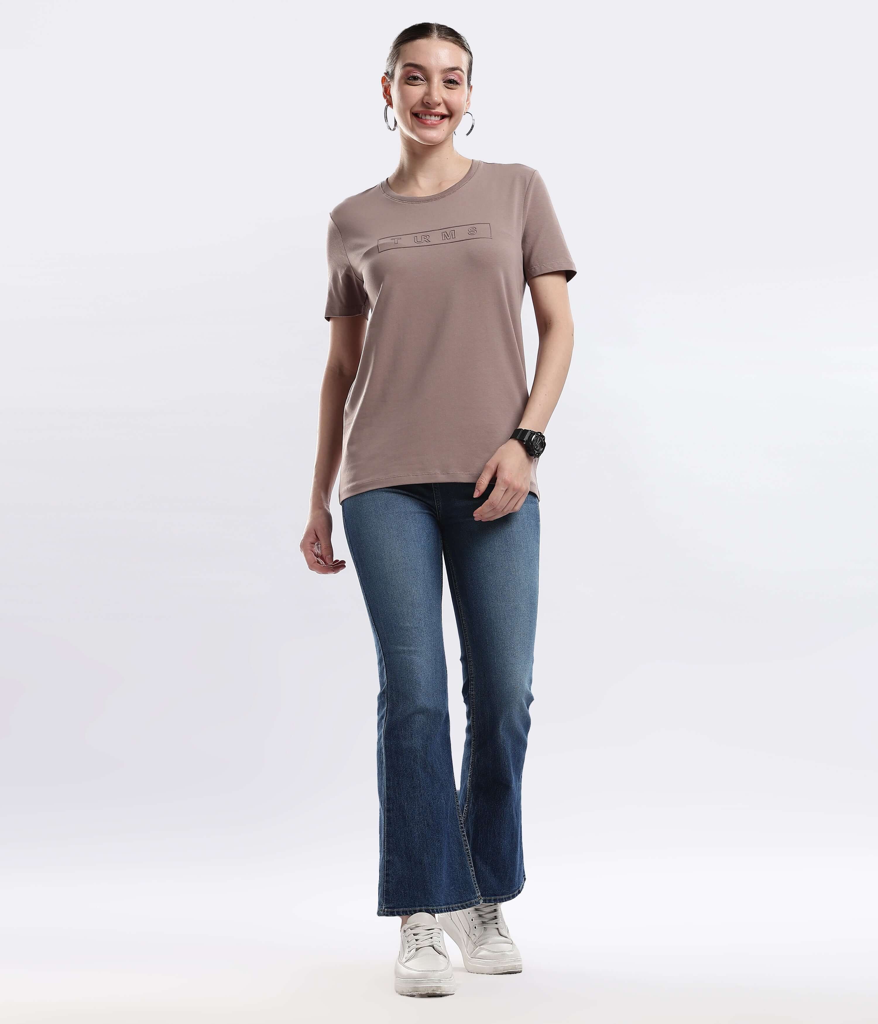 Model wearing Womens casual t-shirt Garnet Brown cotton tshirt paired with flared jeans, showcasing style and comfort.
