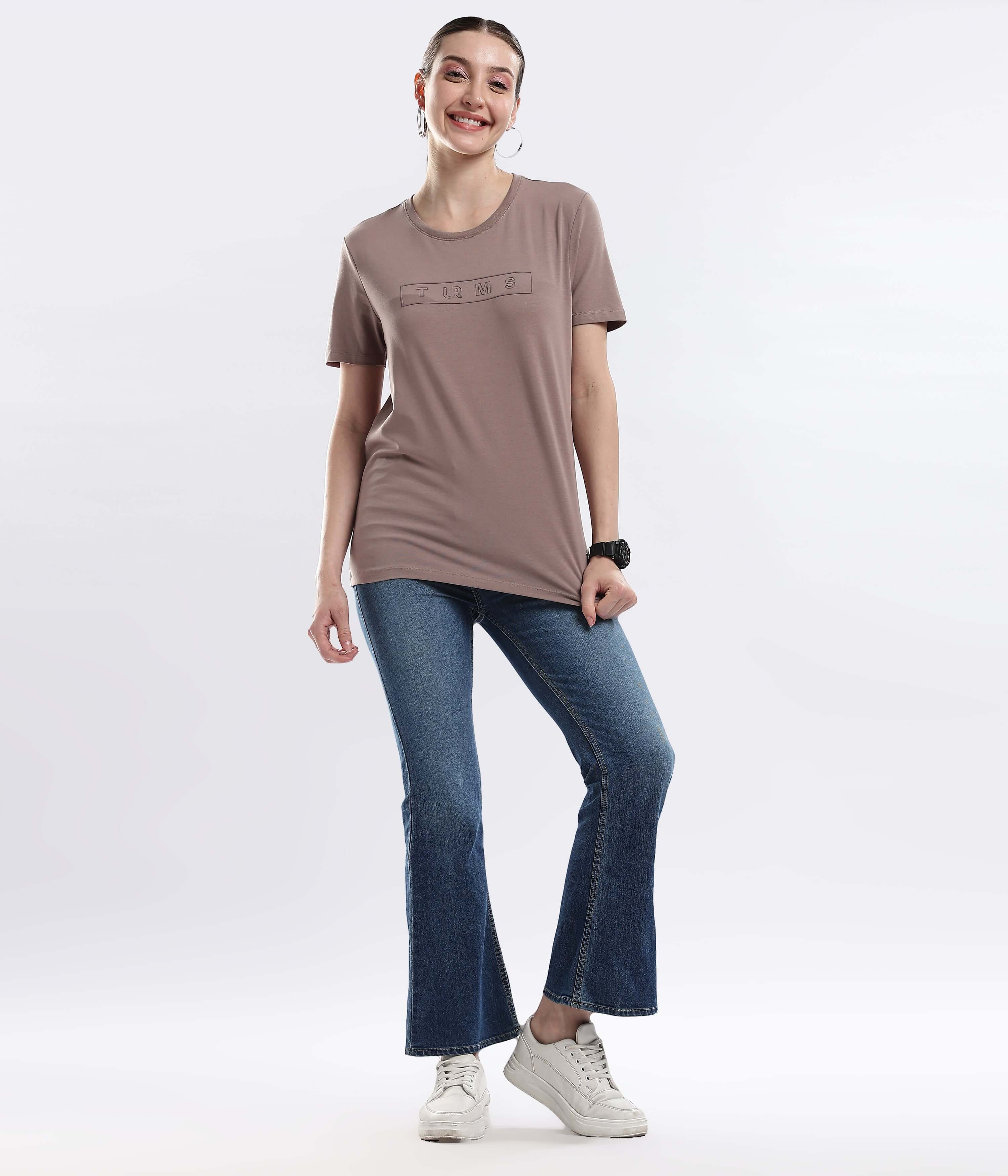 Model wearing Womens casual t-shirt Garnet Brown cotton tshirt with flared jeans, showcasing style and comfort in everyday wear.