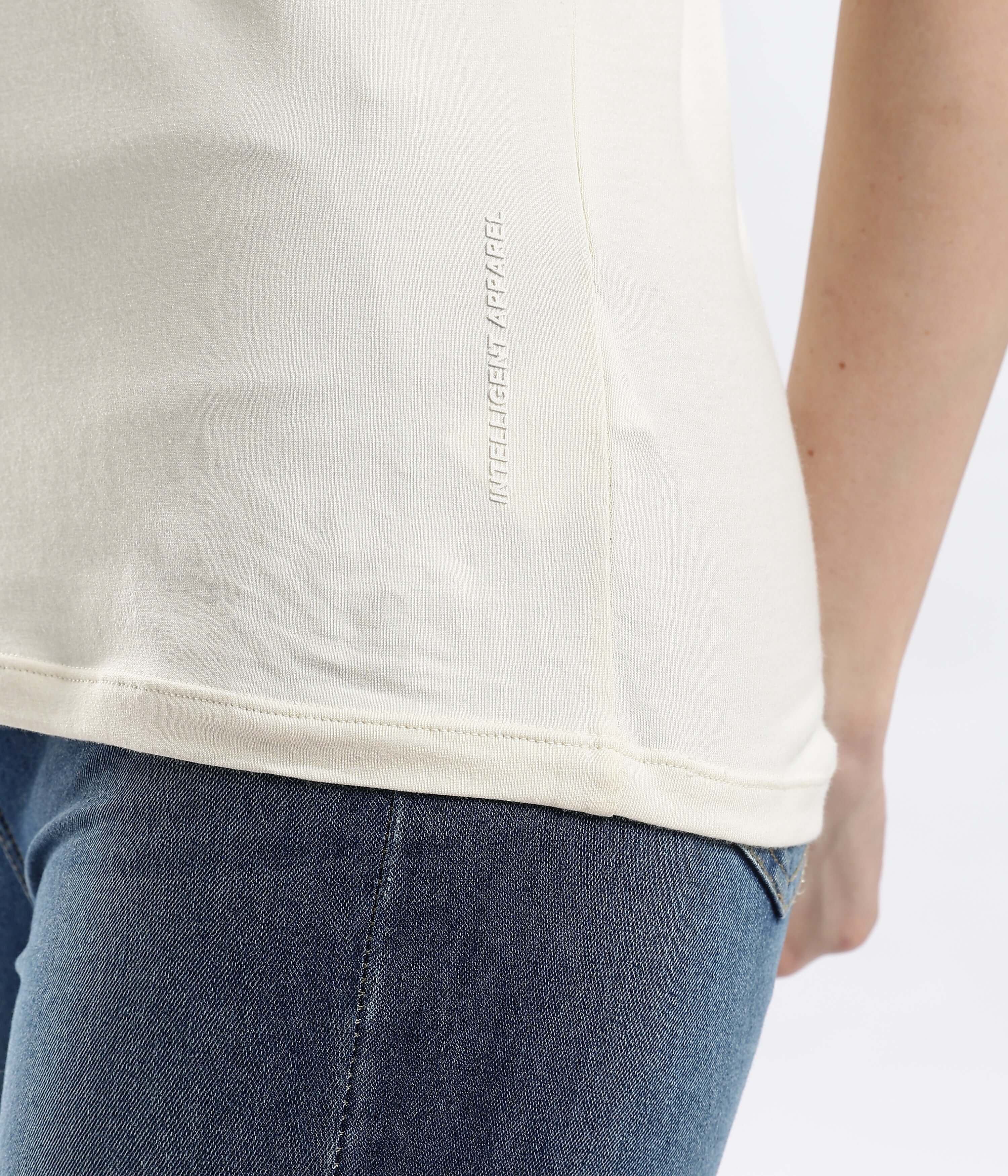 Detail of Polar Off-white cotton t-shirt showing intelligent fabric technology, stretchable and water proof.