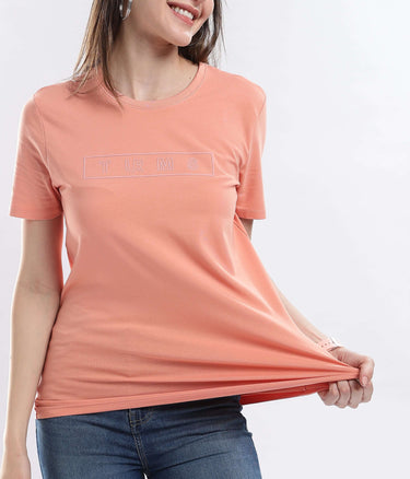Woman wearing Womens casual t-shirt Ember Orange Turms Worry-Free Intelligent T-Shirt, showcasing its soft, stretchable, waterproof, and anti-odour features.