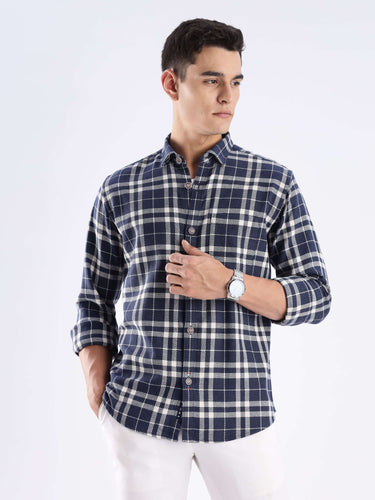 Man wearing a sustainable recycled cotton checked shirt by Turms, showcasing style and functionality.