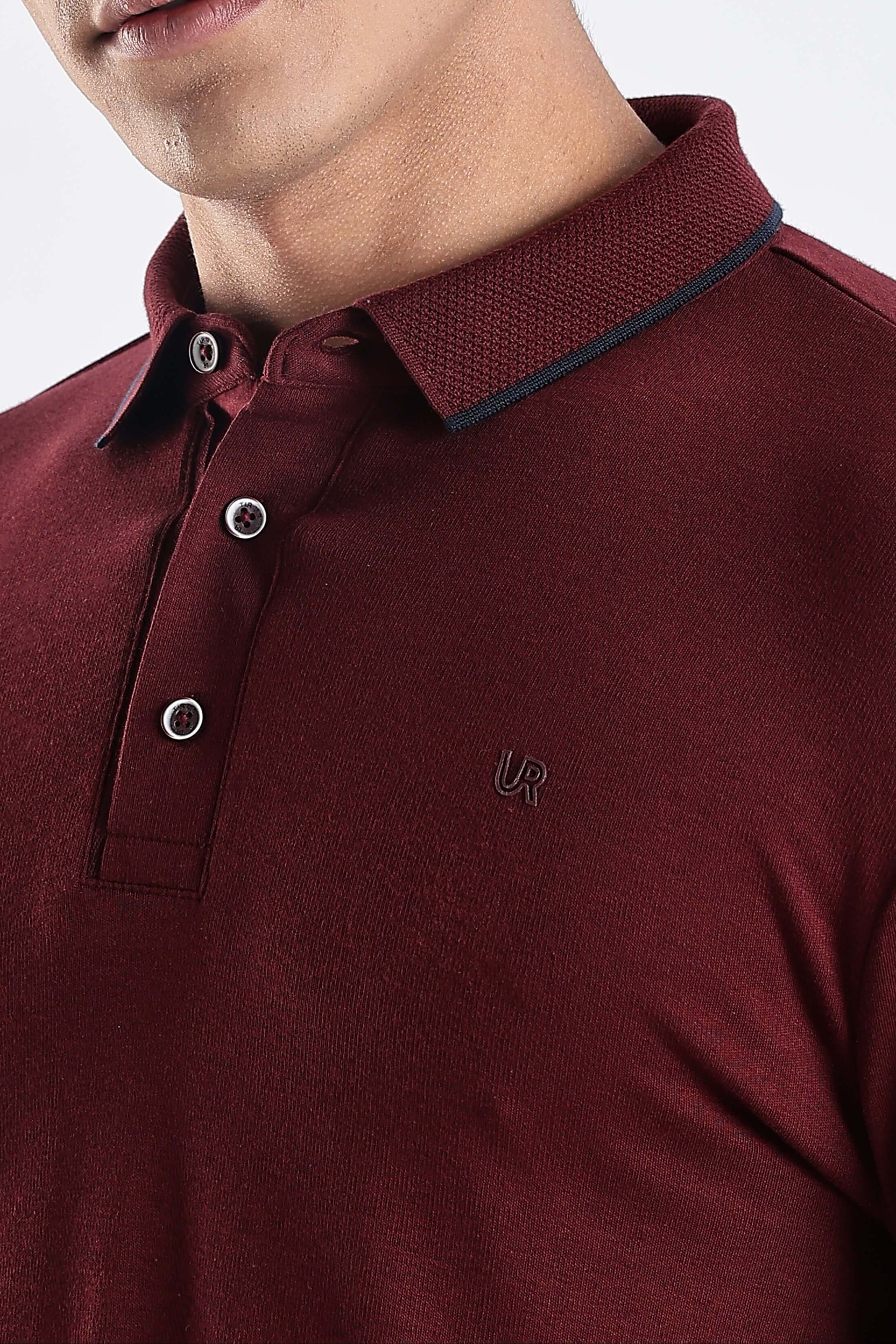 Close-up of a man wearing a Country Wine polo tshirt, showcasing its premium cotton and stylish design.