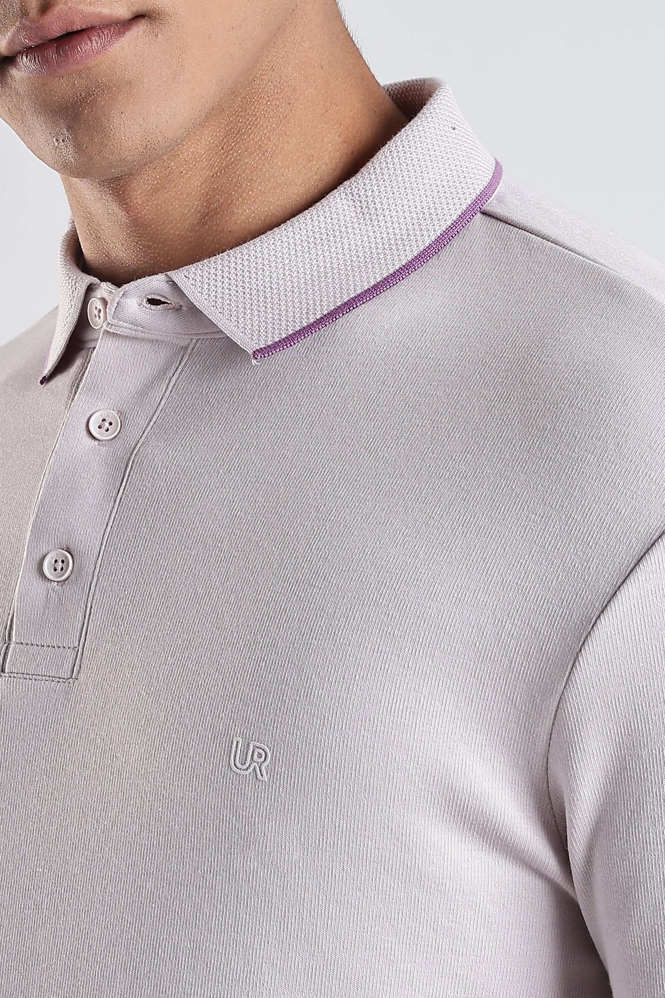 Close-up of a man wearing a Lavender Fires premium cotton polo tshirt with stylish collar.