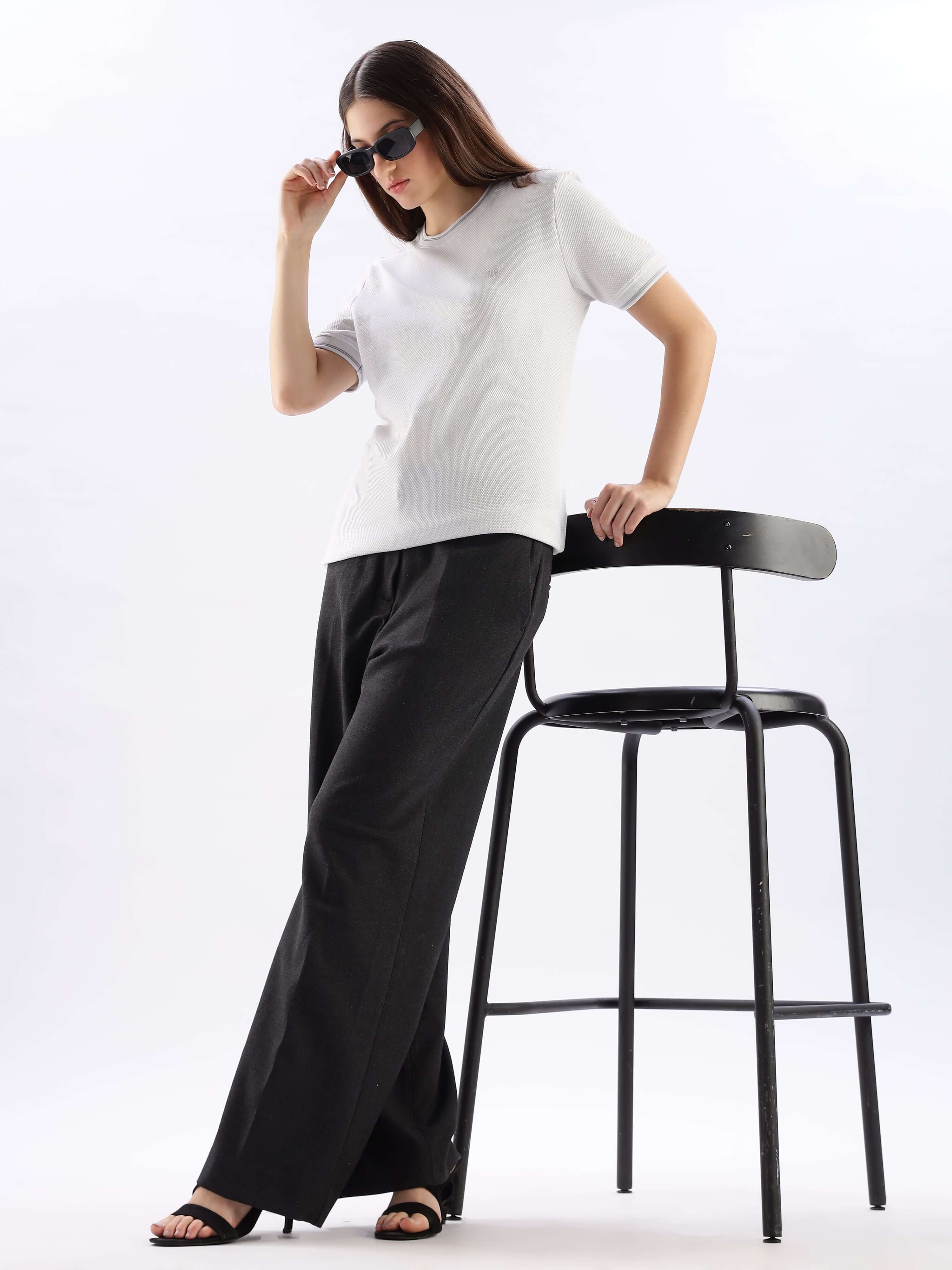 Model wearing Nova Grey round neck cooltech t-shirt with black trousers, exuding comfort and style.