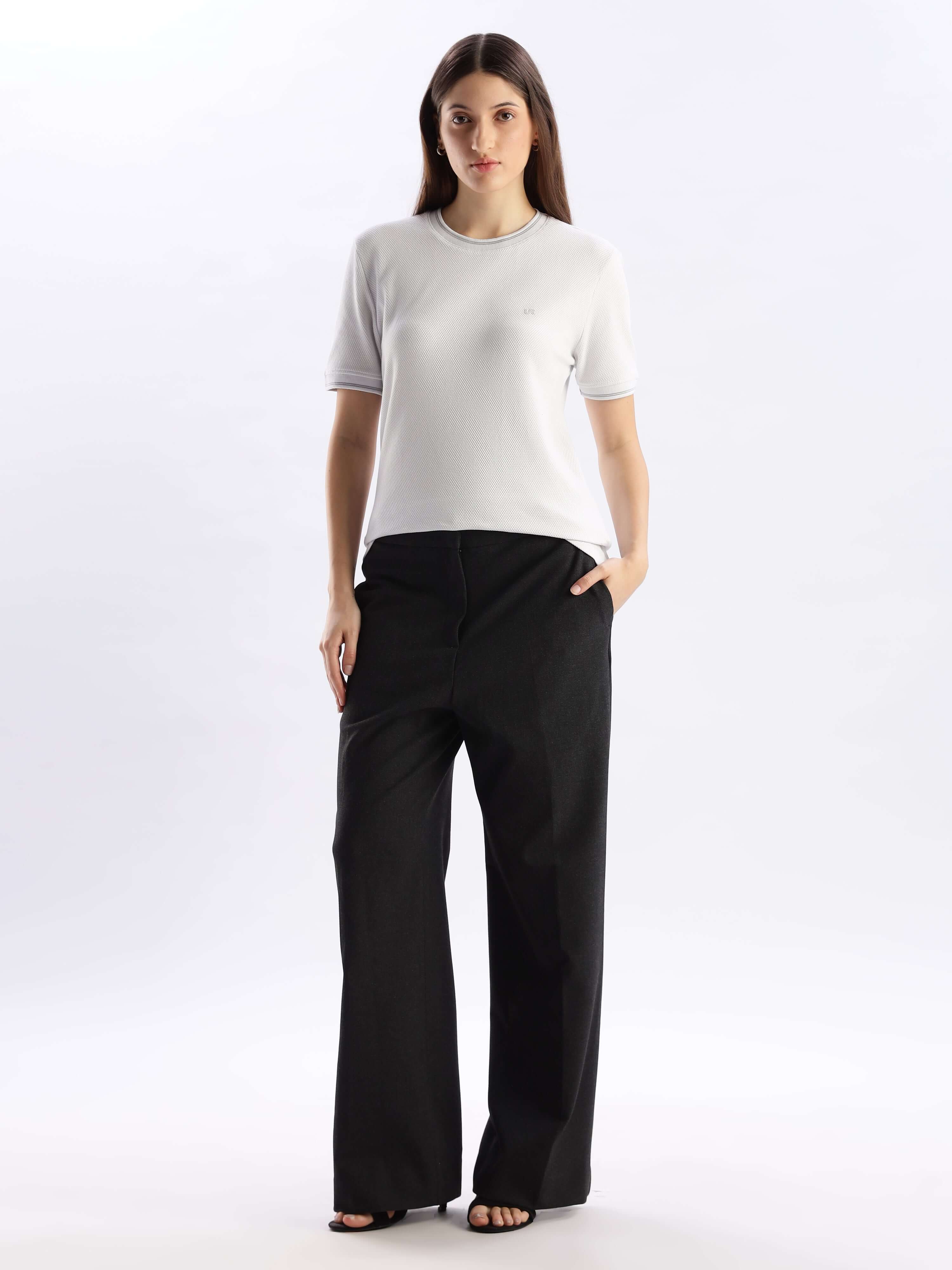 Model wearing Nova Grey Turms Intelligent Ice Cool Tech T-Shirt with comfortable black pants, showcasing style and functionality.