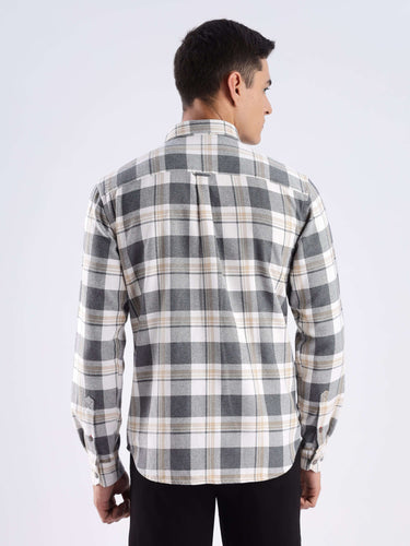 Back view of a man wearing a stylish Urban Ochre recycled cotton checked shirt, showcasing its durable fabric and quality design.
