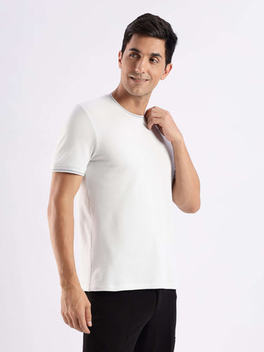 Man in a white Turms Intelligent Ice Cool T-Shirt showcasing style and comfort with temperature control and anti-odour features.